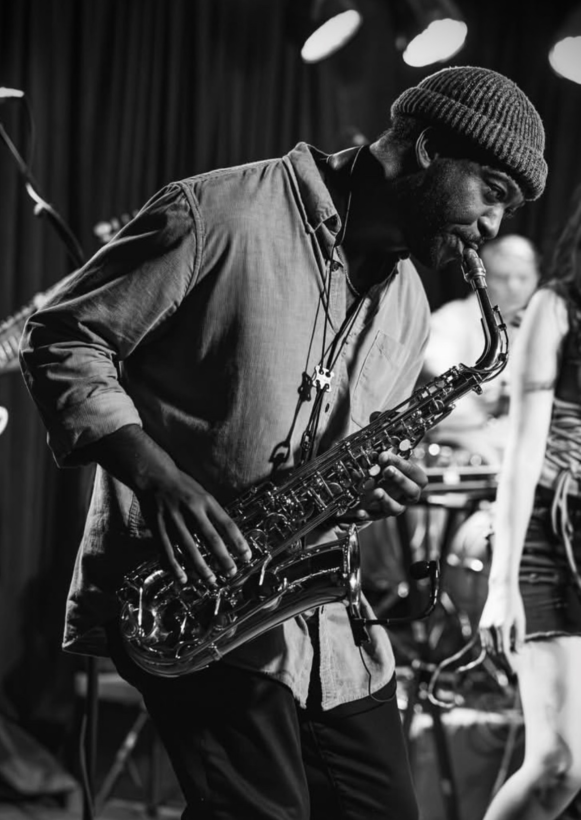 TAVE playing saxophone on stage: the opening photo of the TaveSax.com artist website